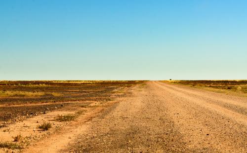 Dirt road through the Gibber Country to the Simpson Desert - Australian Stock Image