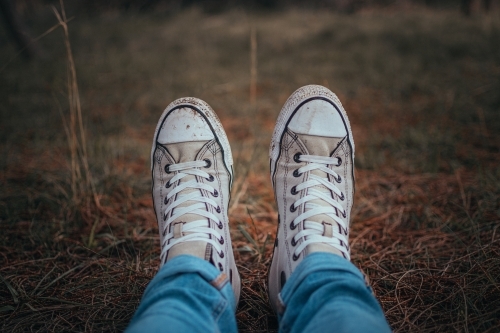 Dirty Shoes - Sitting in a bed of pine needles. - Australian Stock Image