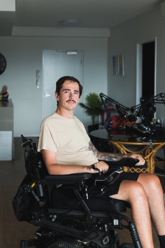 disabled man in wheelchair at home