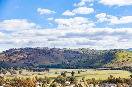 Distant bridge over Murrumbidgee river Gundagai - Australian Stock Image