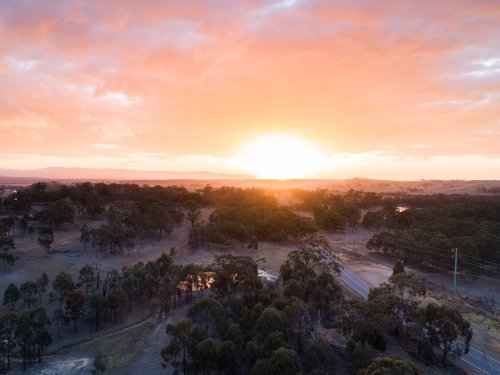 Distant paddock landscape with smokey sky - Australian Stock Image