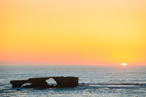 Doorway Rock in Robe created by the sea waves - Australian Stock Image