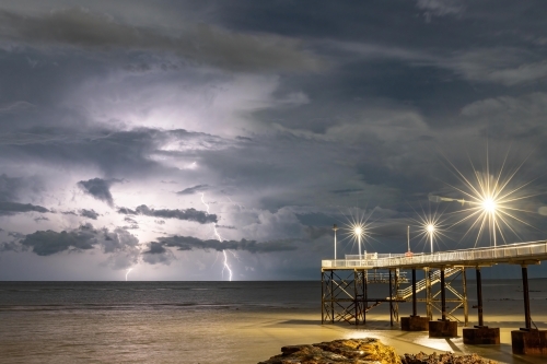 Double lightning strike at Nightcliff Jetty at night - Australian Stock Image