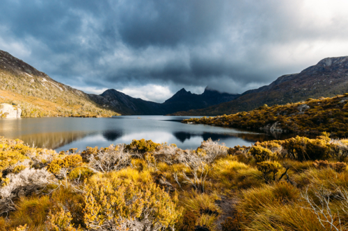 Dove Lake and Cradle Mountain on a cool stormy spring afternoon near sunset in Tasmania - Australian Stock Image