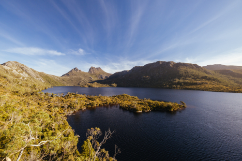 Dove Lake and Cradle Mountain on a warm autumn afternoon near sunset in Cradle Mountain, Tasmania - Australian Stock Image