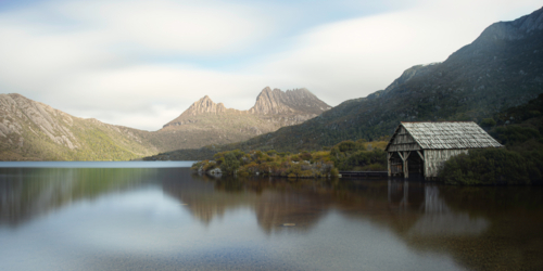 Dove Lake Boathouse with Cradle Mountain in the distance - Australian Stock Image