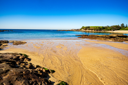 dramatic coastal landscape of Little Bay beach - Australian Stock Image
