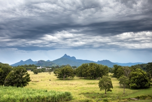 Dramatic storm clouds over mountain region - Australian Stock Image