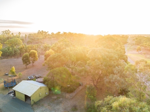 Driveway and green shed on rural property - Australian Stock Image