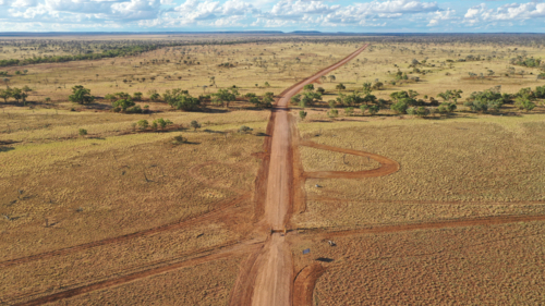 Drone shot of a dirt road post flood repair - Australian Stock Image