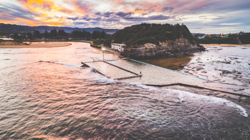 Dusk over North narrabeen rockpool and Narrabeen Head - Australian Stock Image