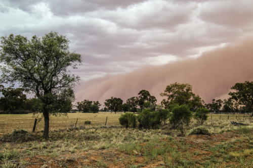 Dust storm in the sky over vast farmland - Australian Stock Image