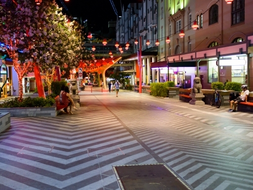 Early evening photo of Chinatown with patterned paving and red lanterns - Australian Stock Image