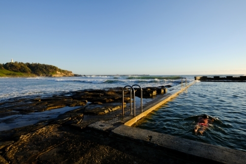 Early morning dip in the ocean pool - Australian Stock Image