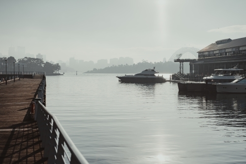 Early morning sun haze over the water at Pirrama Park/Jones Bay Wharf, Sydney NSW. June 2019 - Australian Stock Image