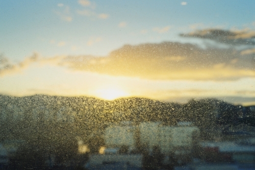 Early morning sunrise views over Brisbane city from apartment window - Australian Stock Image