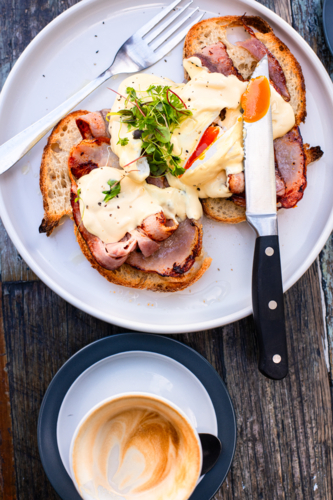eggs benedict with coffee - Australian Stock Image