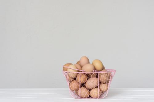 eggs in a pink wire basket