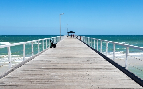 elderly couple walking on jetty - Australian Stock Image