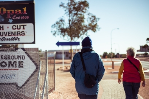 Elderly couple walking through Alice springs - Australian Stock Image