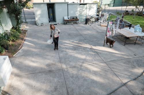 Elevated View of Aboriginal Woman in Backyard - Australian Stock Image
