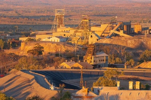 Elevated view of sheds and towers of a mining operation in the outback