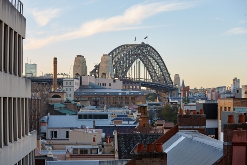 Elevated view of Sydney Harbour Bridge and The Rocks on dusk - Australian Stock Image