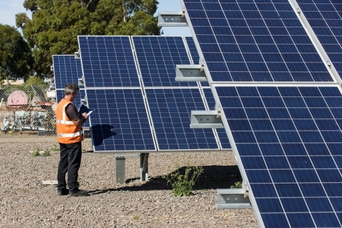 Employee taking notes at Solar Panel plant - Australian Stock Image