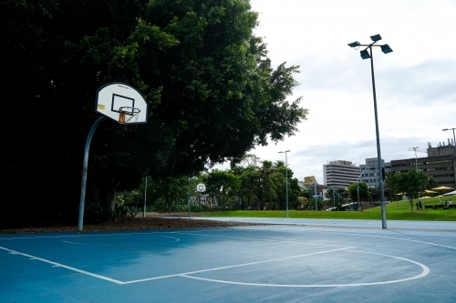 Empty basketball court in local park - Australian Stock Image