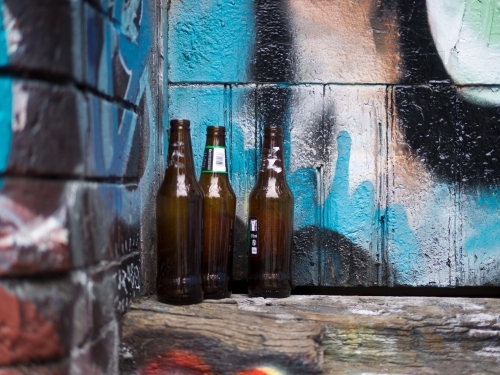 Empty Beer Bottles in a Laneway - Australian Stock Image