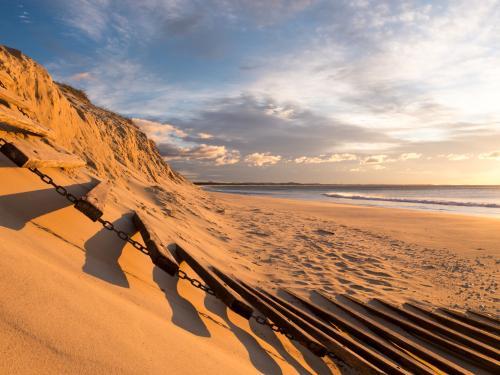 Erosion of beach sand dunes caused by a big storm - Australian Stock Image