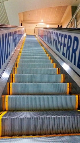 Escalator going up at an international airport - Australian Stock Image