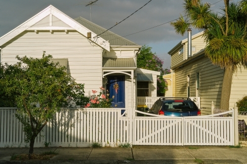 External street view of house with car in drive way