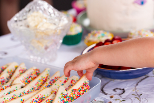 Fairy bread in tray on table at childs birthday party - Australian Stock Image