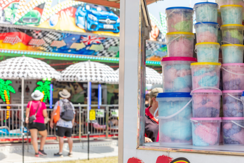 Fairy Floss for sale, rides in the background, Royal Show - Australian Stock Image