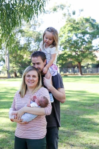 Family four, standing in line - Australian Stock Image