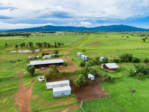 Farm buildings and stockyard seen from above on overcast day - Australian Stock Image