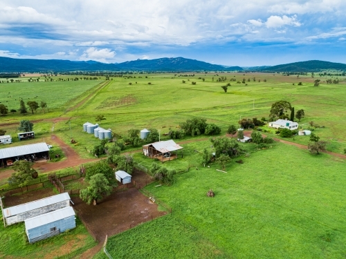 Farm buildings and stockyard seen from above on overcast day - Australian Stock Image