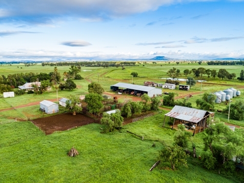 Farm buildings and stockyard seen from above on overcast day - Australian Stock Image
