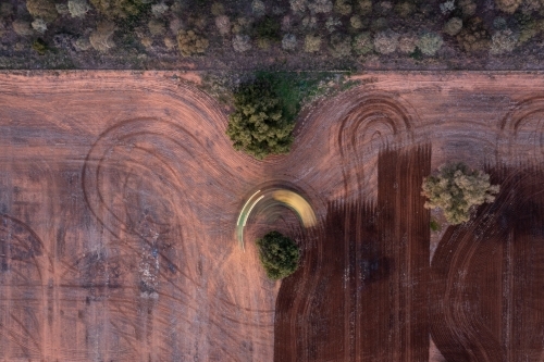 Farm vehicle does U turn while ploughing paddock