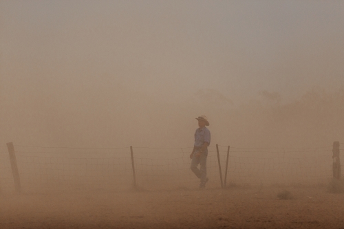 Farmer in dust storm - Australian Stock Image