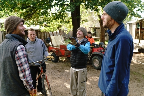 Farmhands Joking Around in a Rural Setting