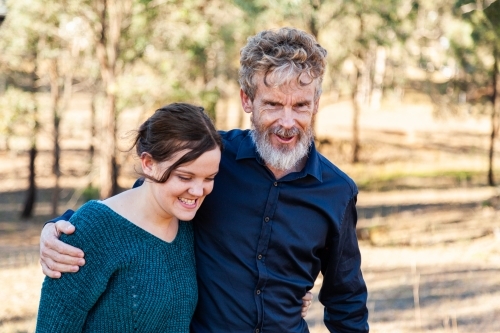 Father and adult daughter hug - Australian Stock Image