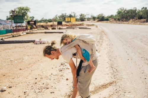 Father and daughter walking on rural streets - Australian Stock Image