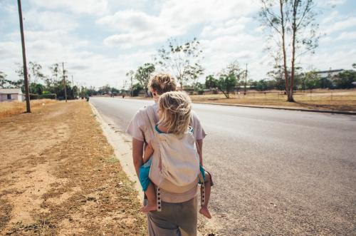 Father and daughter walking on rural streets