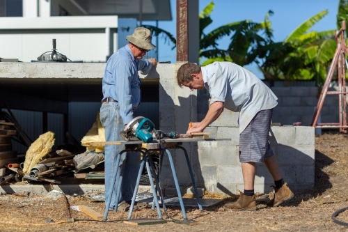 Father and son working together on a building project