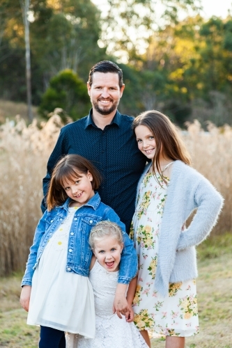 Father with his three young daughters - Australian Stock Image