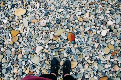 Feet standing on rocks