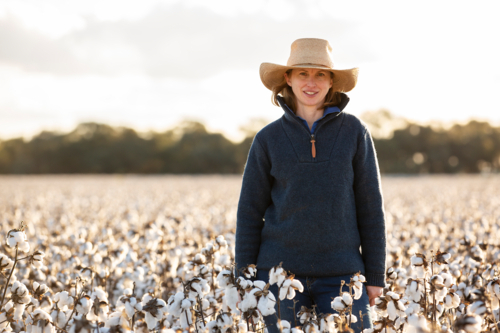 Female farmer in cotton crop at harvest - Australian Stock Image