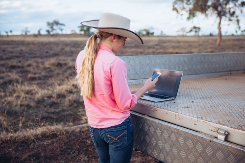 Female farmer using technology
